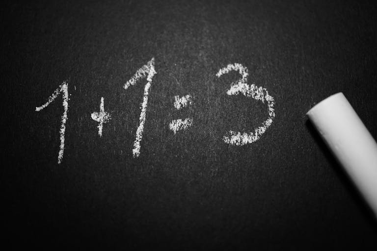 Chalkboard with a humorous incorrect math equation, ideal for educational settings.